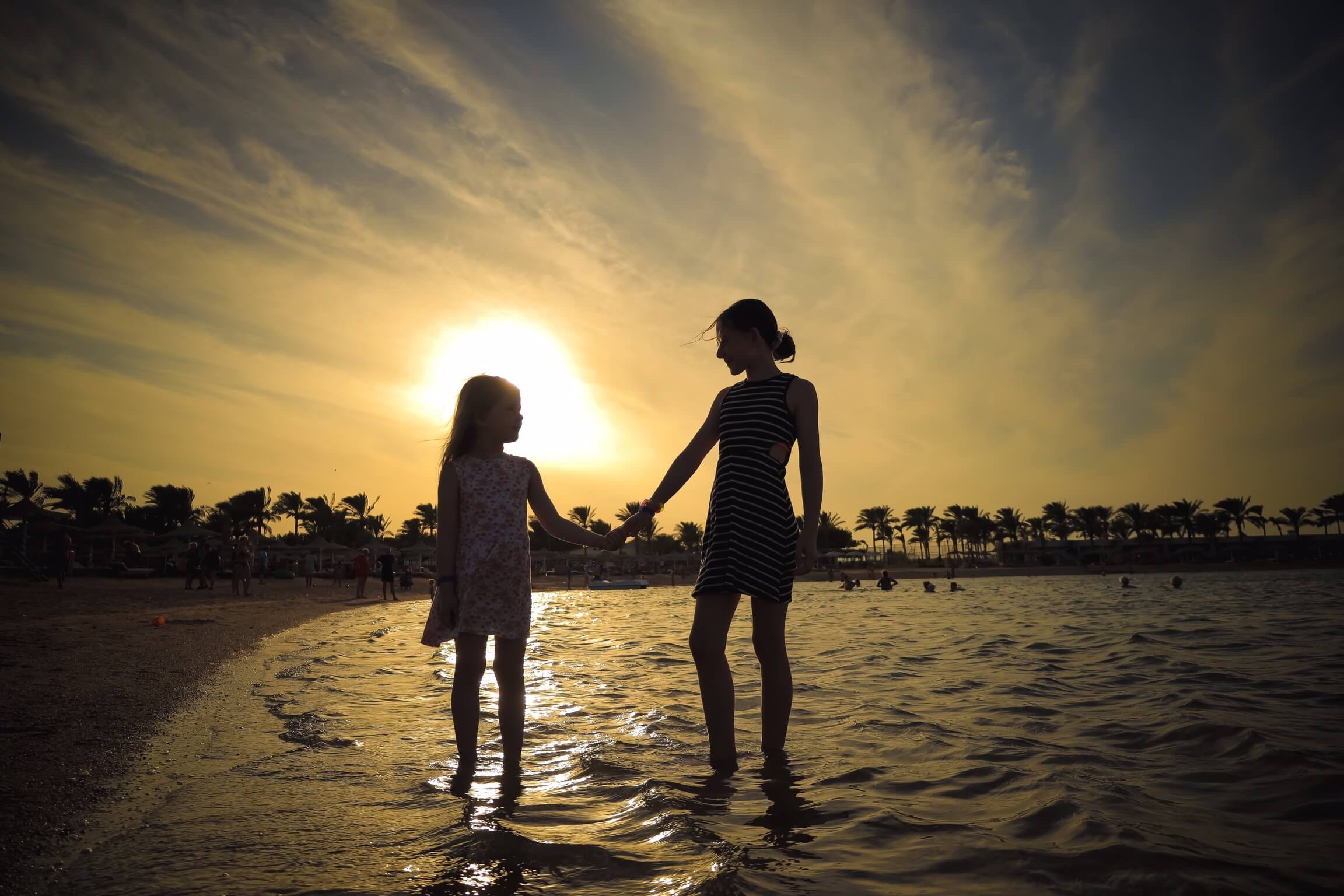 Sister's Silhouette at Sunset - Two sisters at sunset.