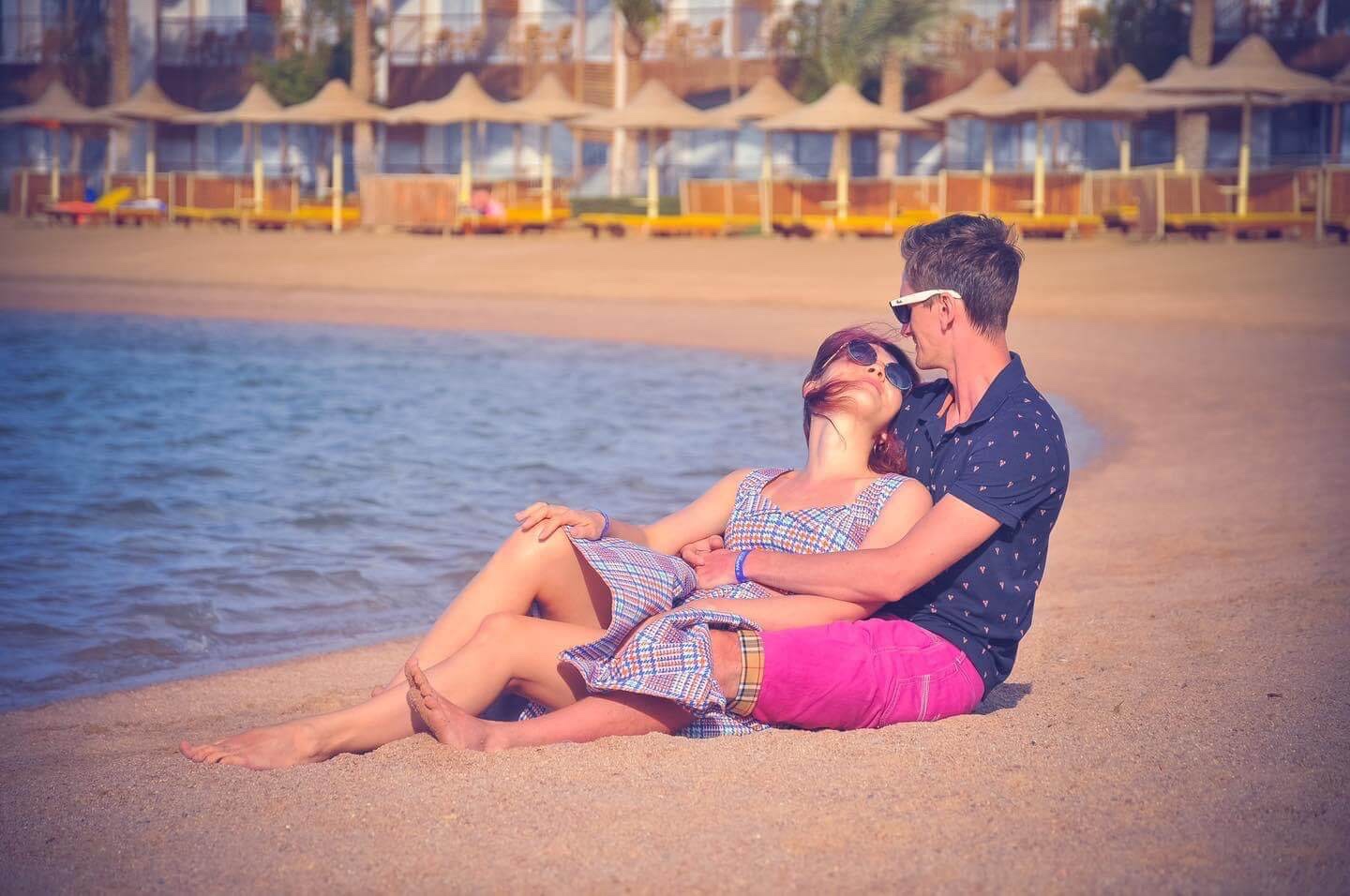 Couple enjoying a lighthearted moment together by the Red Sea in Hurghada, photographed by Kareem Ahmed.